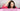 Woman noticing post-menopausal hair loss and hair thinning after menopause
